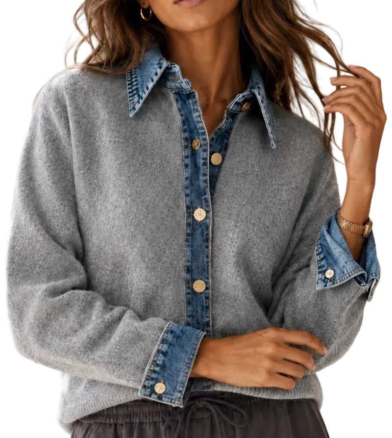 A woman wearing a gray knit button-front shirt with blue denim collar, placket, and sleeve cuffs, paired with dark gray drawstring pants.